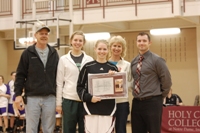 Katie Fetters with family and athletic director Nathan Walker
